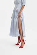 Close-up: slit & red heels detail