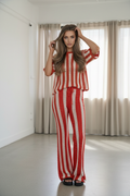 Full body, hand in hair, looking at camera