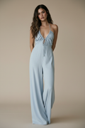 Full body, leaning against wall