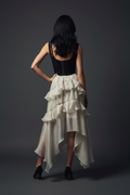 Full body – one hand on hip, back to camera