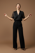 Head back, open arms, joyful and aspirational