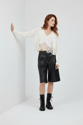 Ivory 9 – Cardigan, arm on wall