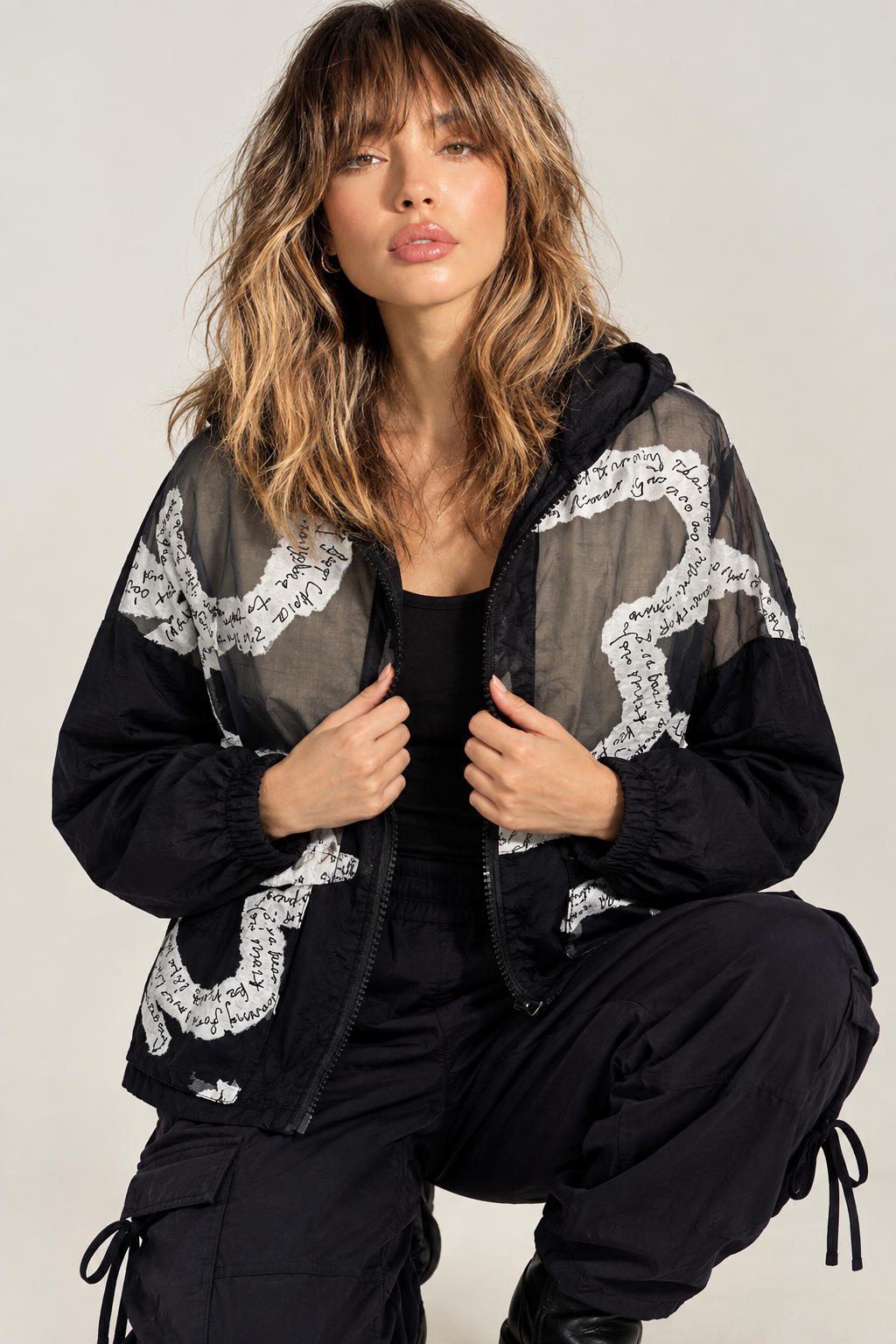 Knees-up jacket portrait