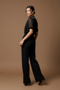 Mid-step turn, fierce over-shoulder silhouette