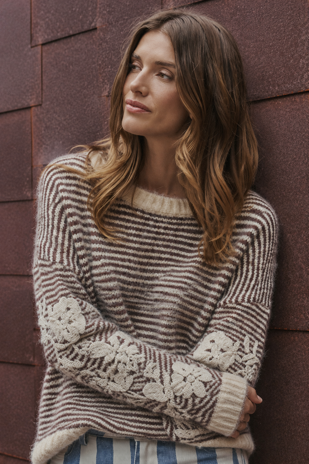 Relaxed folded-arm sweater close-up