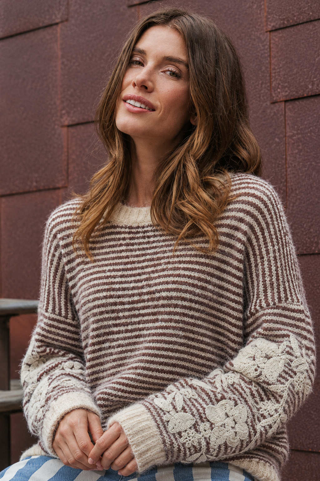 Seated close-up with a soft smile