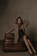Seated — legs crossed, calm