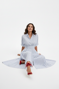 Seated, legs extended, leaning back