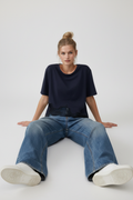 Seated, legs extended