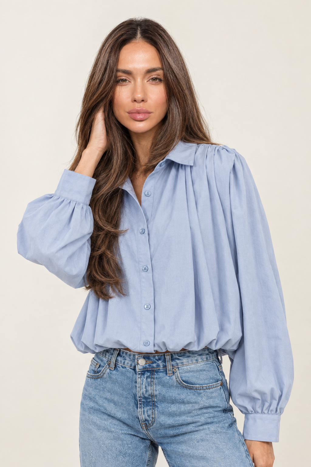 Three-quarter turn right, hand in hair