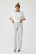 Touching lace hem, hand on hip