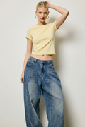 Waist detail — crop tee meets low-rise