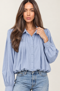 Waist-up close-up of the pleats