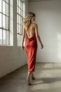 Walking away, mid-stride, hair moving